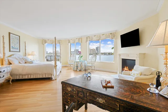 a living room with fireplace furniture and a flat screen tv