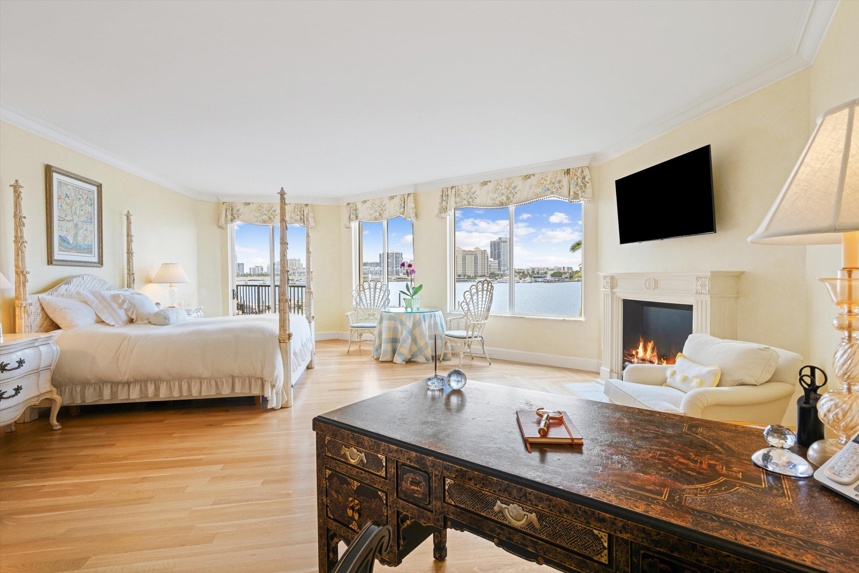 200 Bradley Place, Unit 303 Palm Beach, FL 33480 - Photo 13 of 40 a living room with fireplace furniture and a flat screen tv