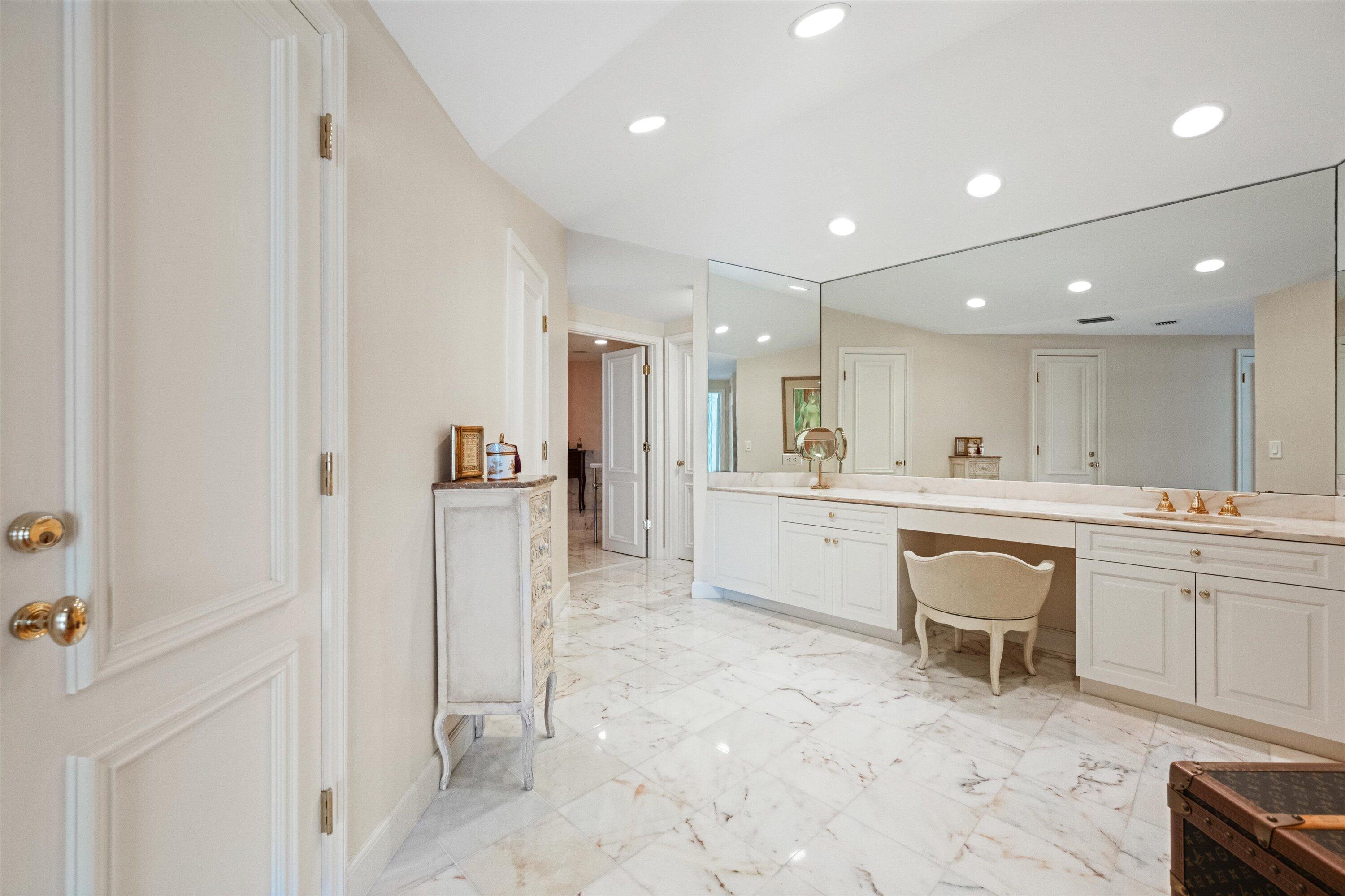 200 Bradley Place, Unit 303 Palm Beach, FL 33480 - Photo 15 of 40 a kitchen with a sink and refrigerator