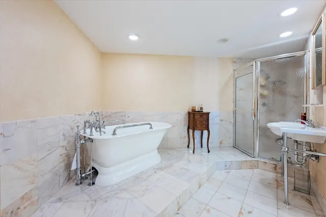 a bathroom with a bathtub and a sink