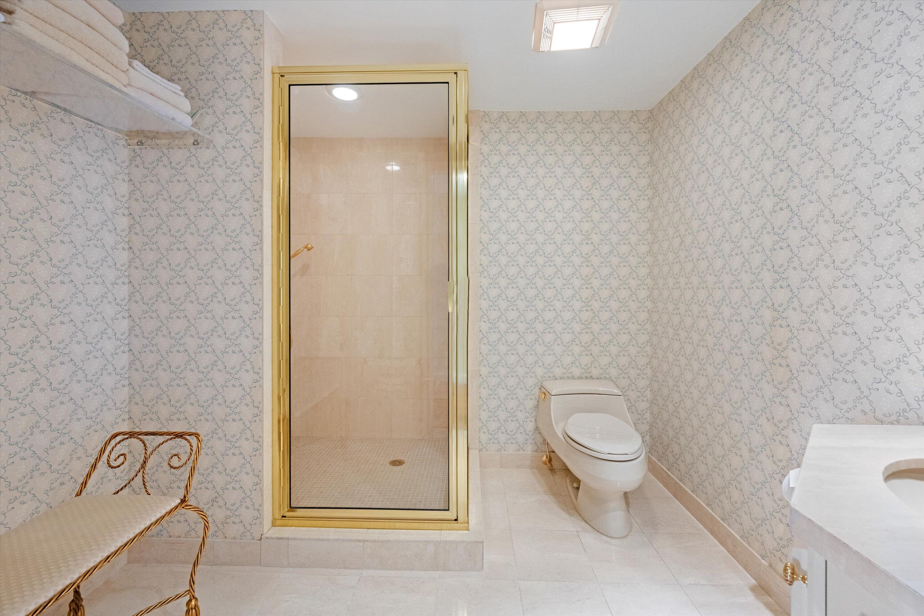 200 Bradley Place, Unit 303 Palm Beach, FL 33480 - Photo 17 of 40 a bathroom with a toilet and a shower