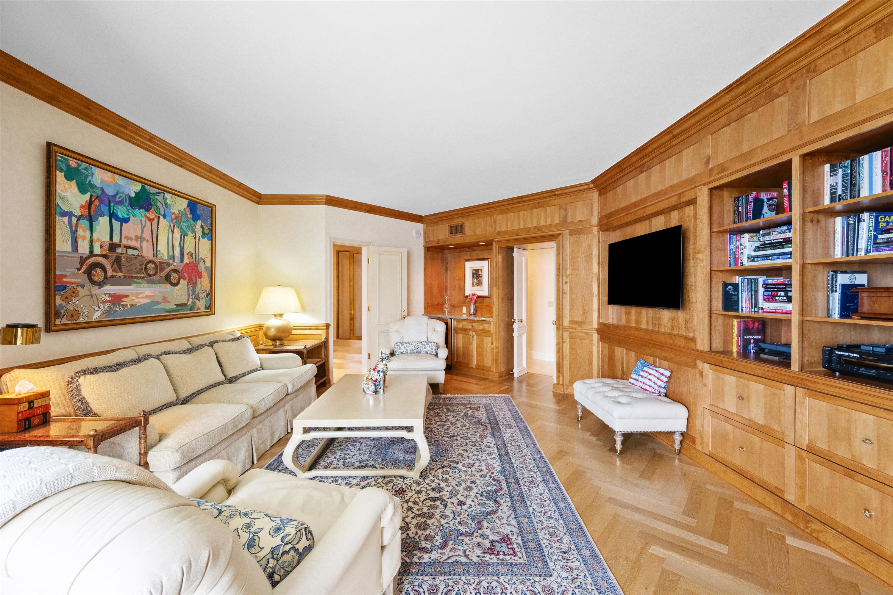200 Bradley Place, Unit 303 Palm Beach, FL 33480 - Photo 21 of 40 a living room with furniture and a flat screen tv