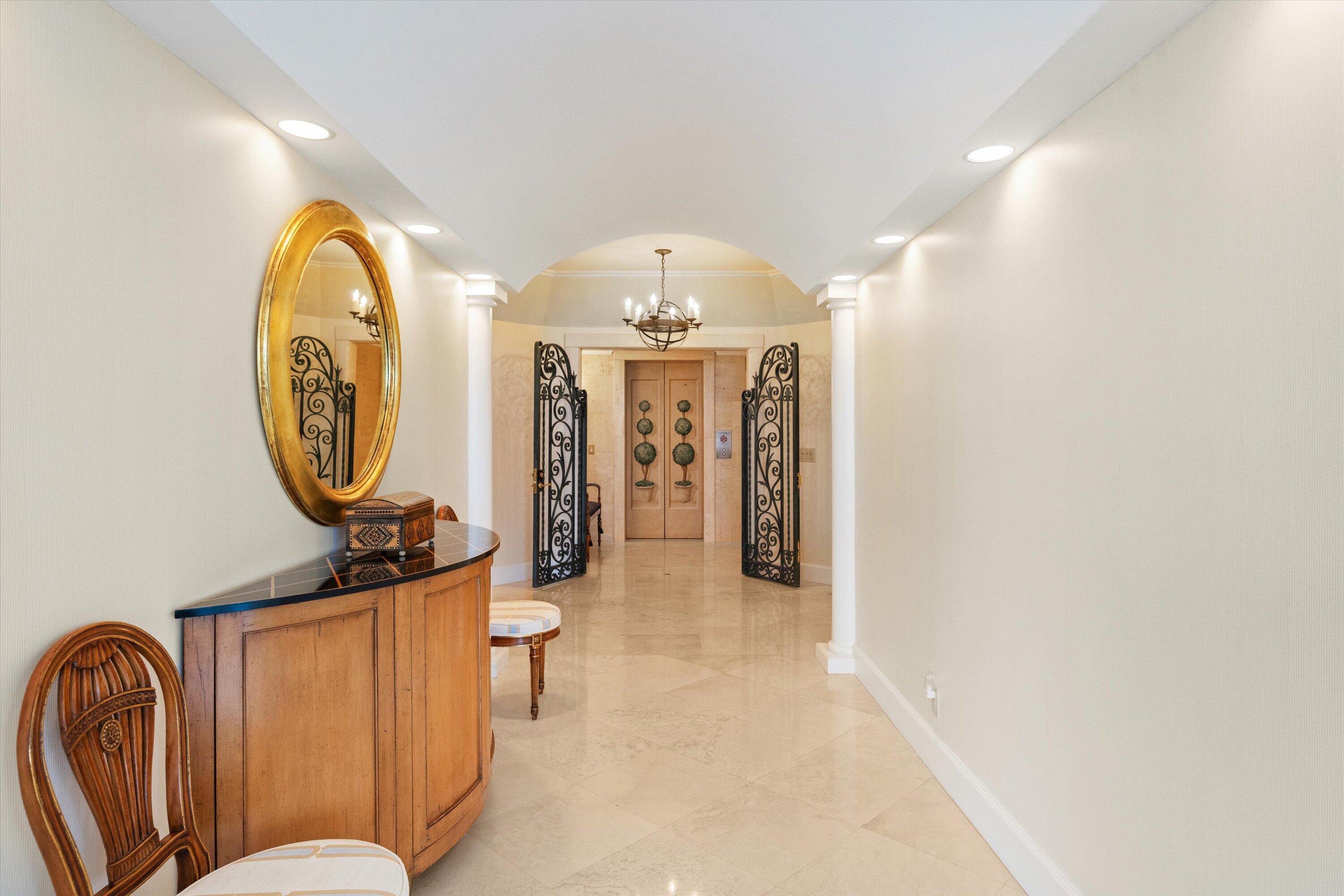200 Bradley Place, Unit 303 Palm Beach, FL 33480 - Photo 25 of 40 a view of a hallway with painted walls