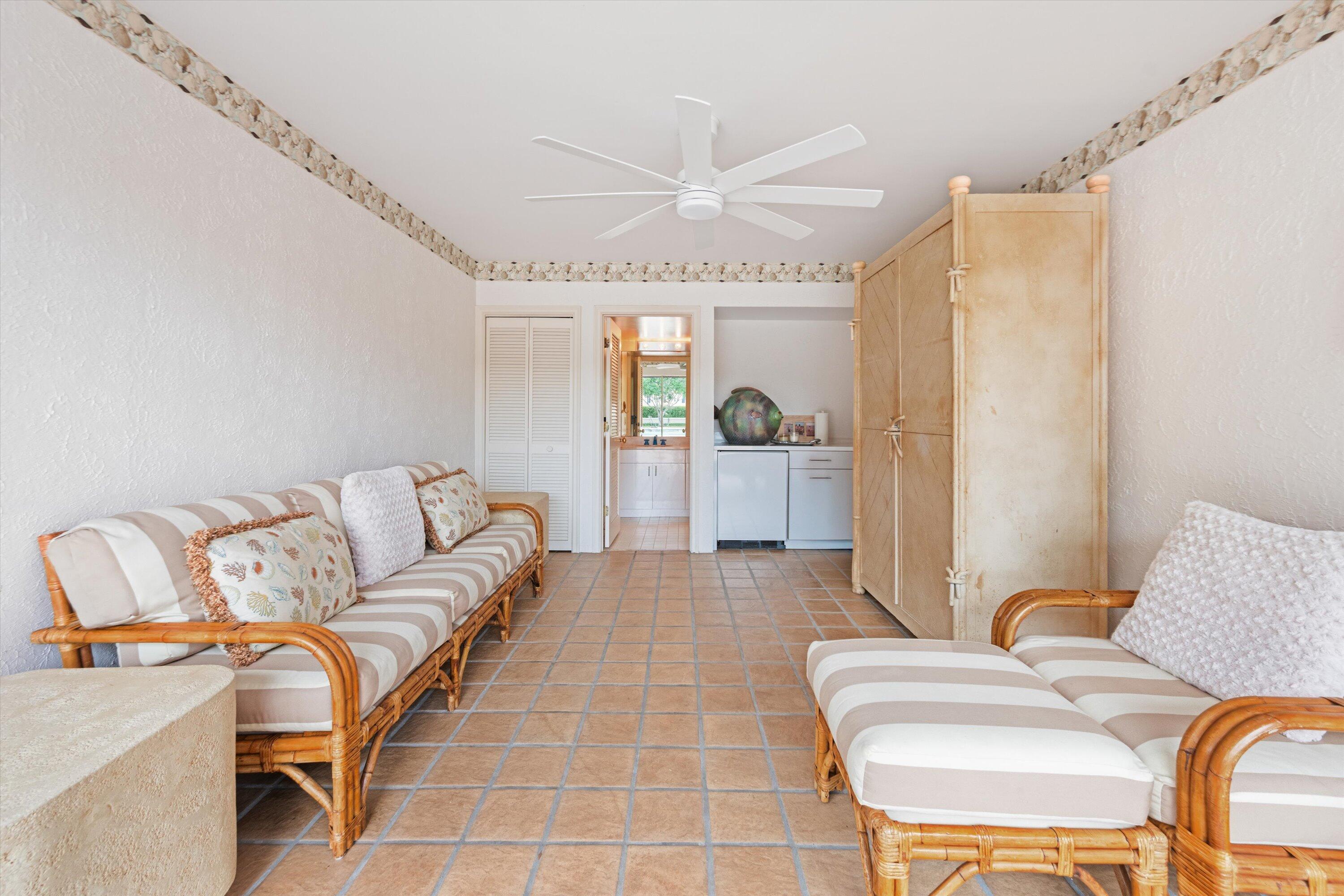 200 Bradley Place, Unit 303 Palm Beach, FL 33480 - Photo 32 of 40 a living room with furniture and a chandelier