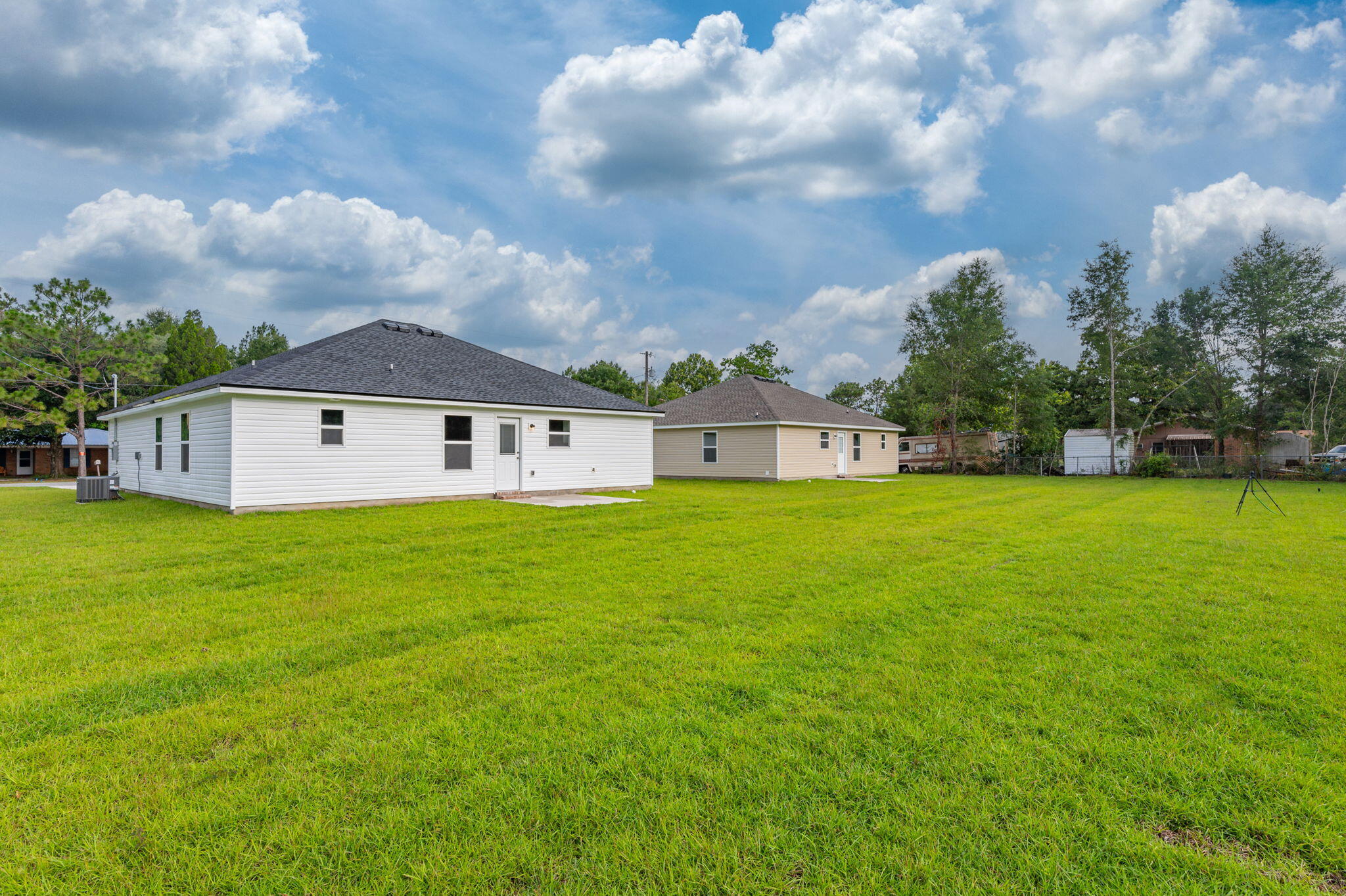 5833 Flamingo Road Crestview, FL 32539 - Photo 29 of 32 a front view of a house with garden