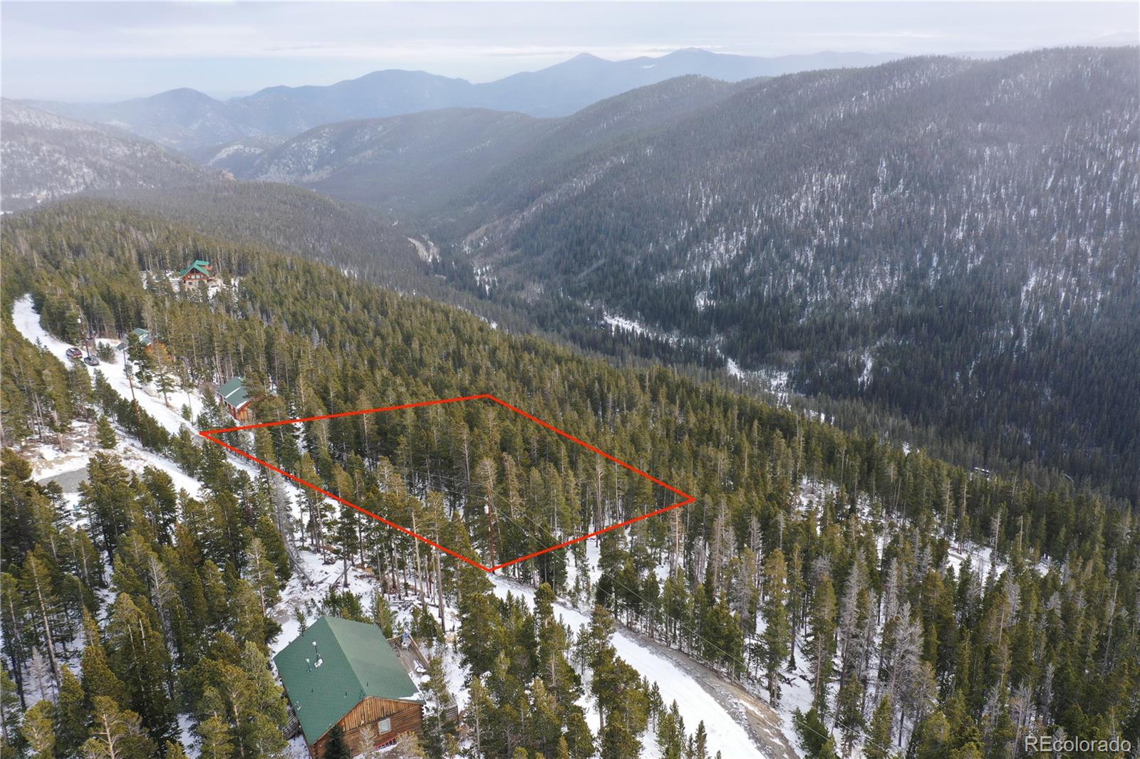 Lot 37 Vista Road Idaho Springs, CO 80452 - Photo 12 of 27 a view of a city with mountains in the background