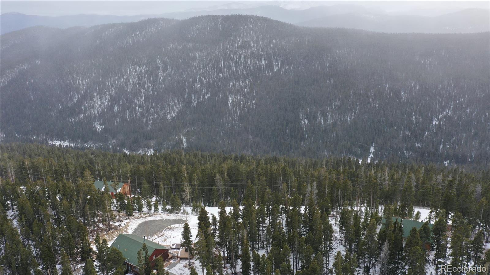 Lot 37 Vista Road Idaho Springs, CO 80452 - Photo 22 of 27 a view of a lake from balcony