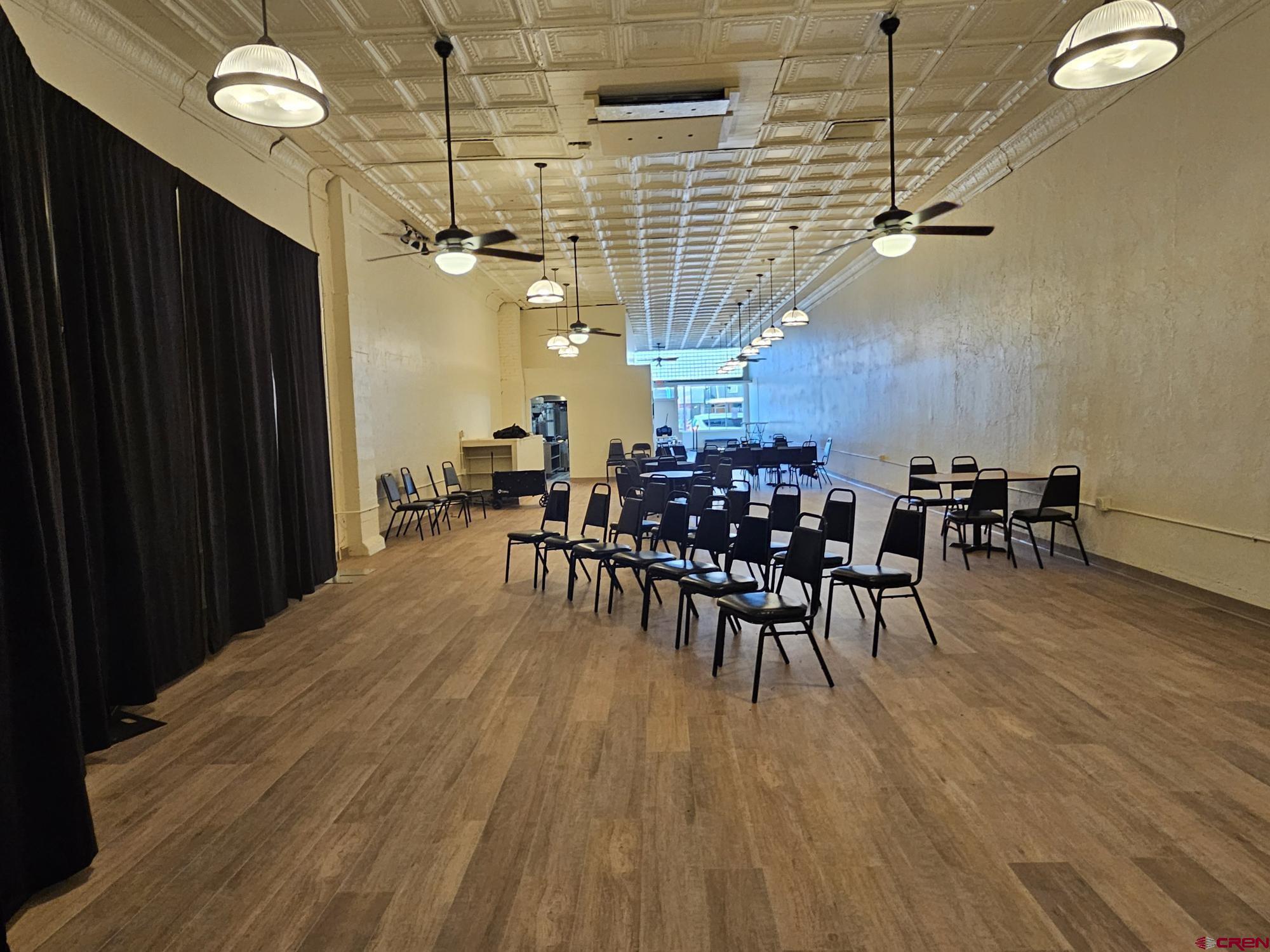 440 Main Street Delta, CO 81416 - Photo 12 of 18 a dining room with furniture and wooden floor