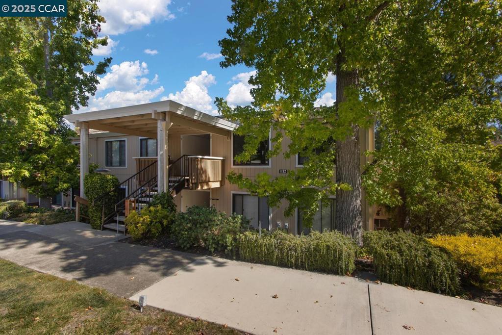 1132 Running Springs Road Walnut Creek, CA 94595 - Photo 1 of 7 a front view of a house with garden