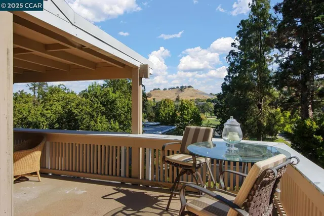 a view of a patio in a backyard