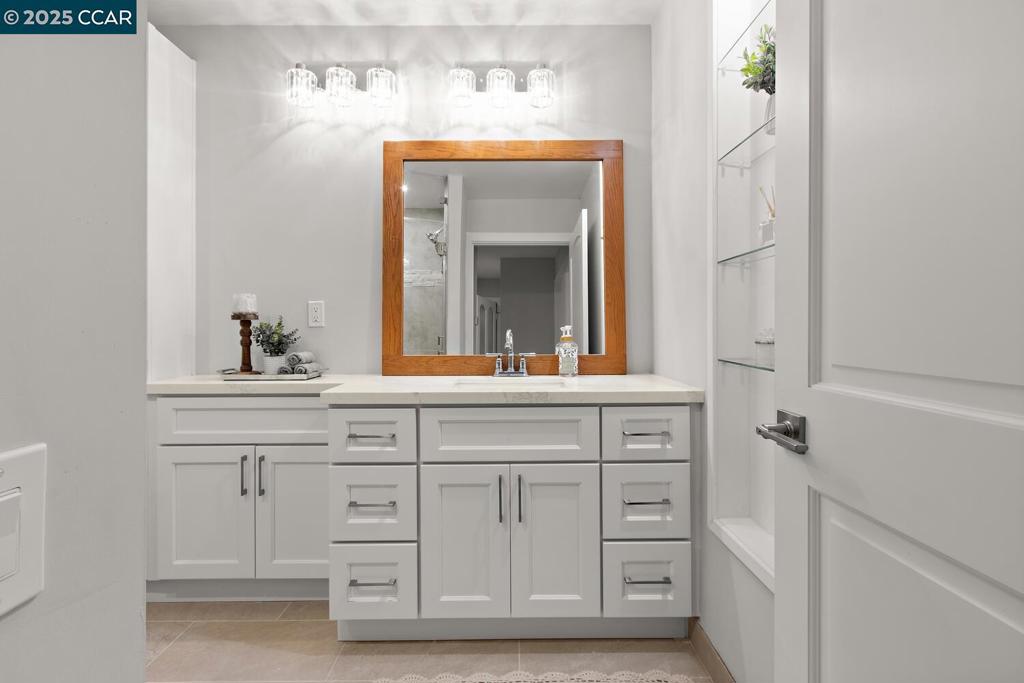 1132 Running Springs Road Walnut Creek, CA 94595 - Photo 6 of 7 a bathroom with a sink vanity and mirror