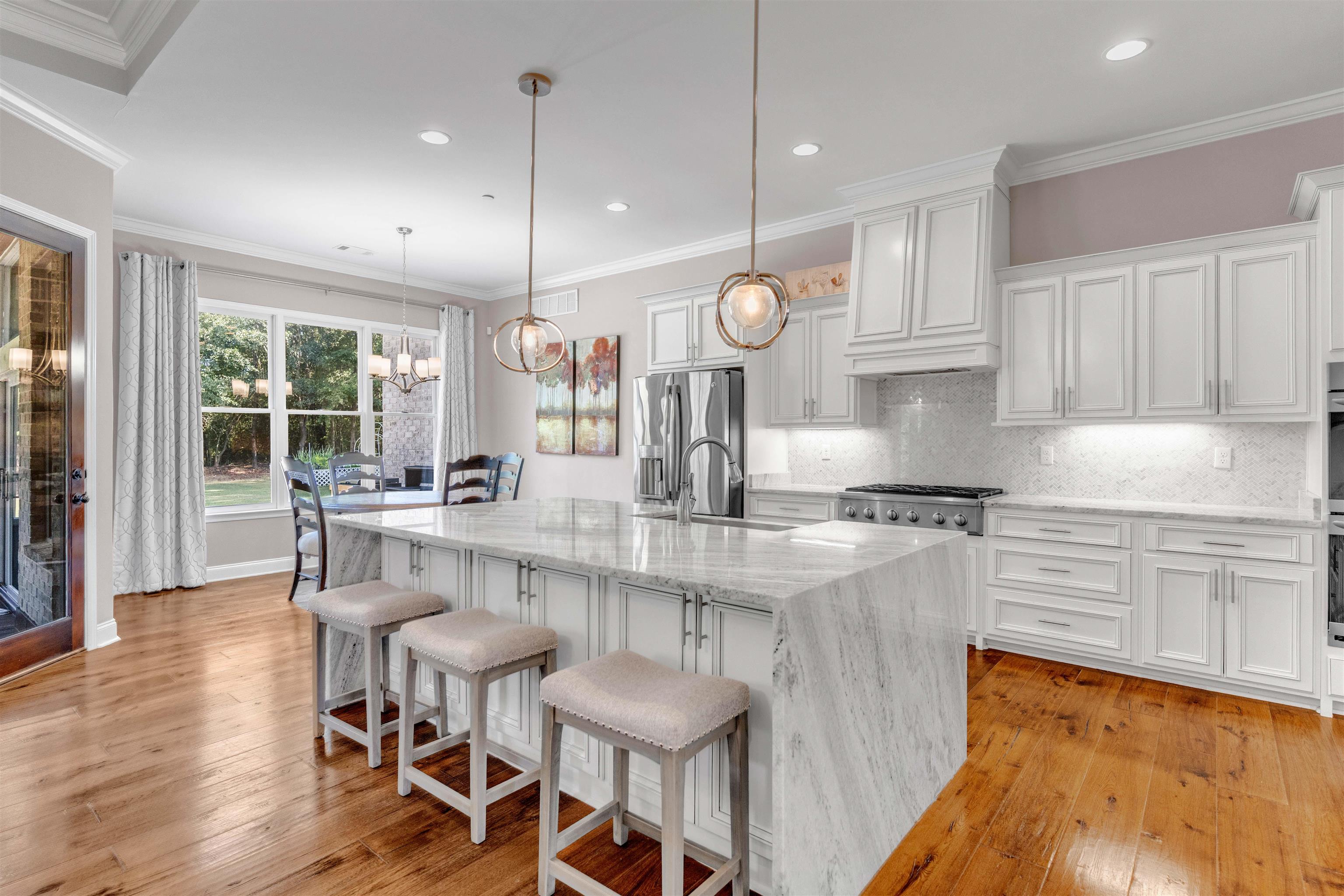 75 Windgrove Cove Piperton, TN 38017 - Photo 11 of 40 a large kitchen with a table and chairs