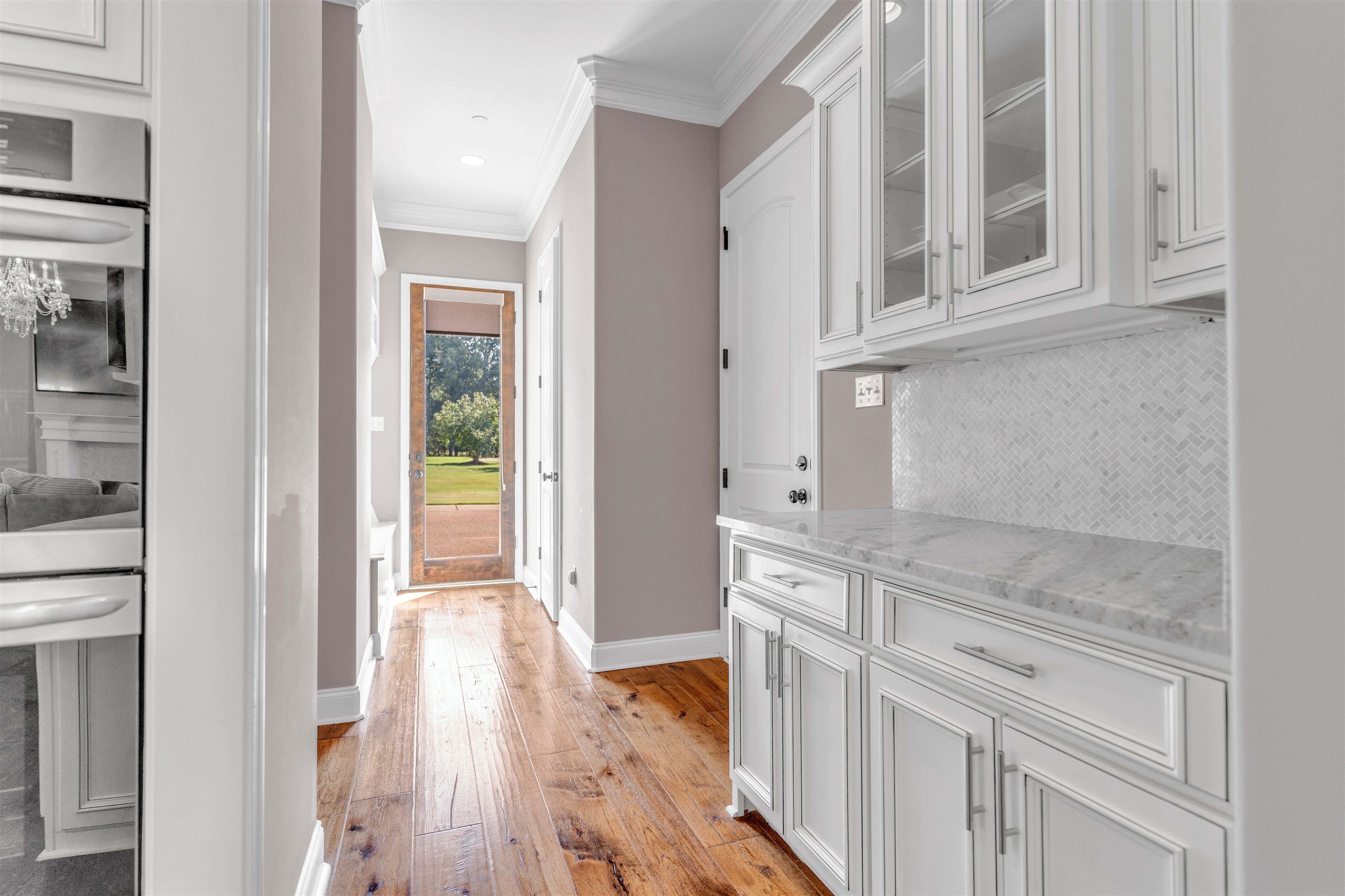 75 Windgrove Cove Piperton, TN 38017 - Photo 14 of 40 a view of a kitchen with a sink and dishwasher with white cabinets
