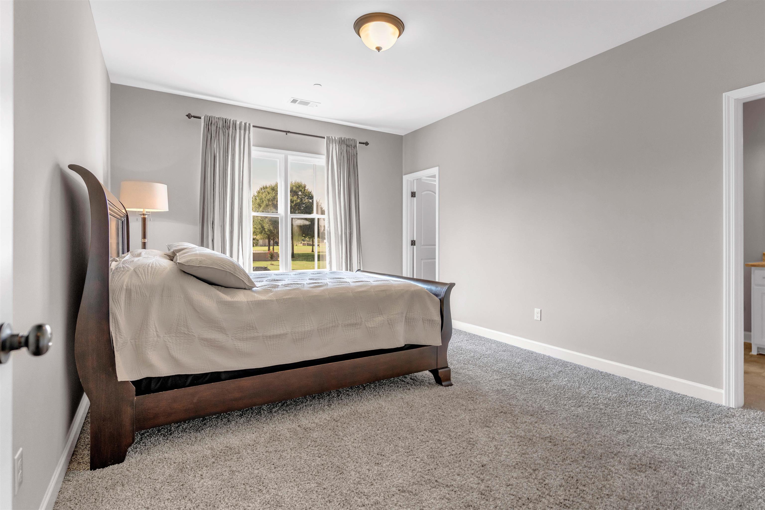 75 Windgrove Cove Piperton, TN 38017 - Photo 29 of 40 a bed sitting in a room next to a window