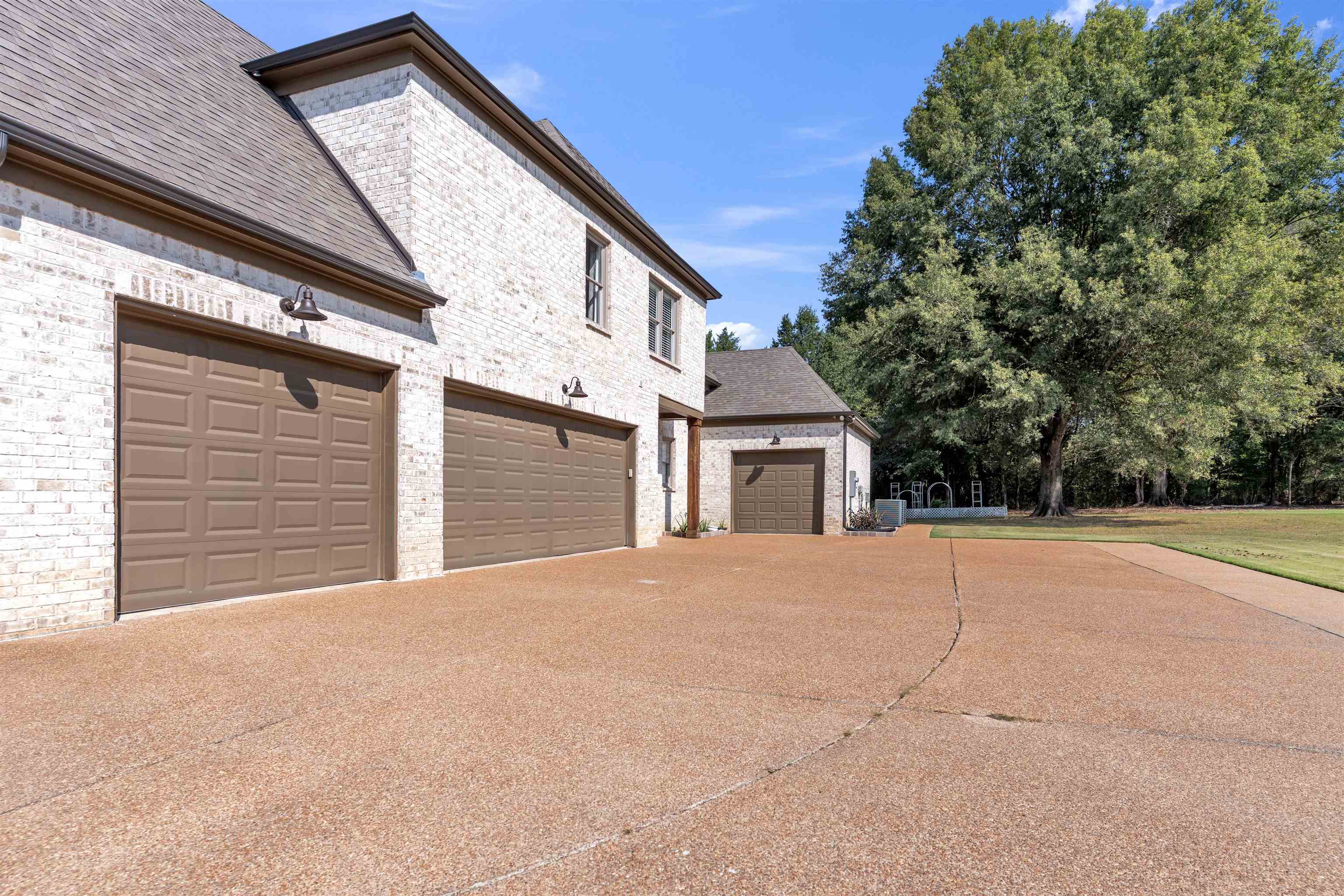 75 Windgrove Cove Piperton, TN 38017 - Photo 39 of 40 a front view of a house with a yard and garage