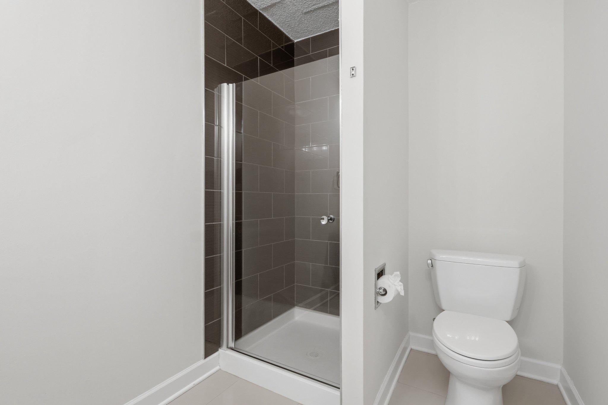 1101 St Paul Street, Unit 1212 Baltimore, MD 21202 - Photo 34 of 36 Sleek modern master bathroom with shower.