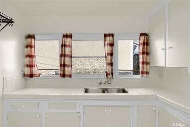 a kitchen with appliances cabinets and a sink