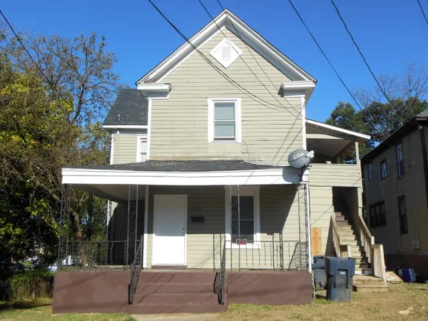a front view of a house with garage