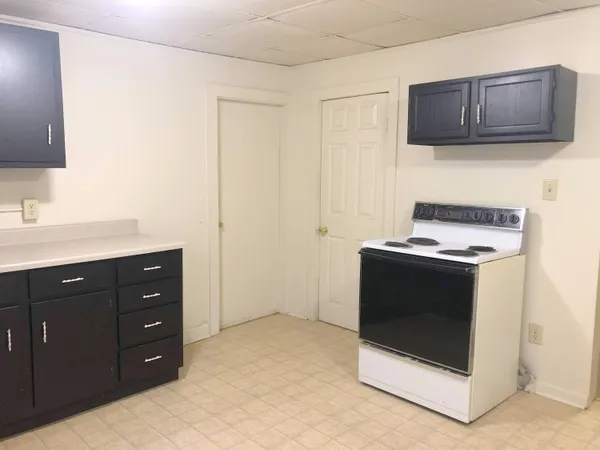 a white refrigerator freezer sitting in a kitchen