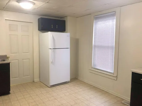 an empty room with closet area