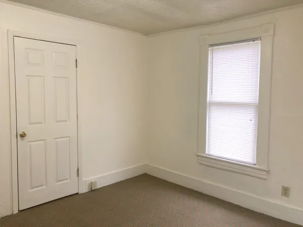 a bathroom with a glass door