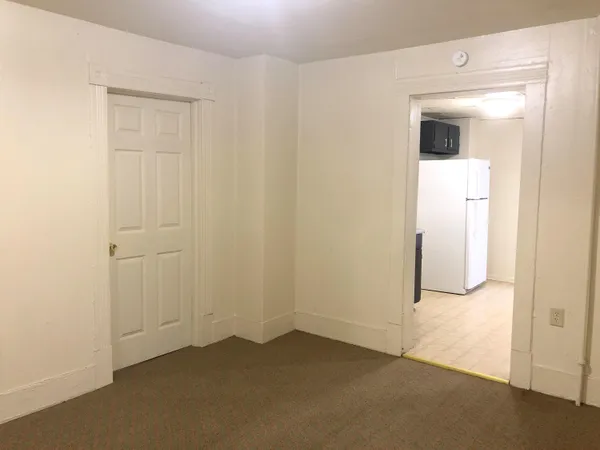 an empty room with a empty space and sink