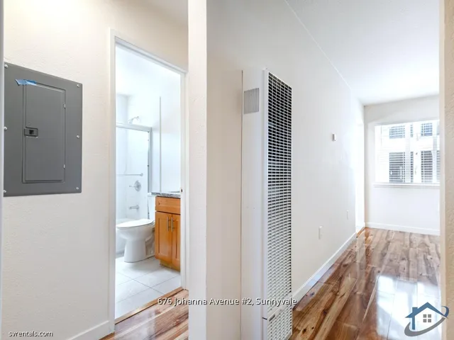 a bathroom with a granite countertop sink a toilet and bathtub