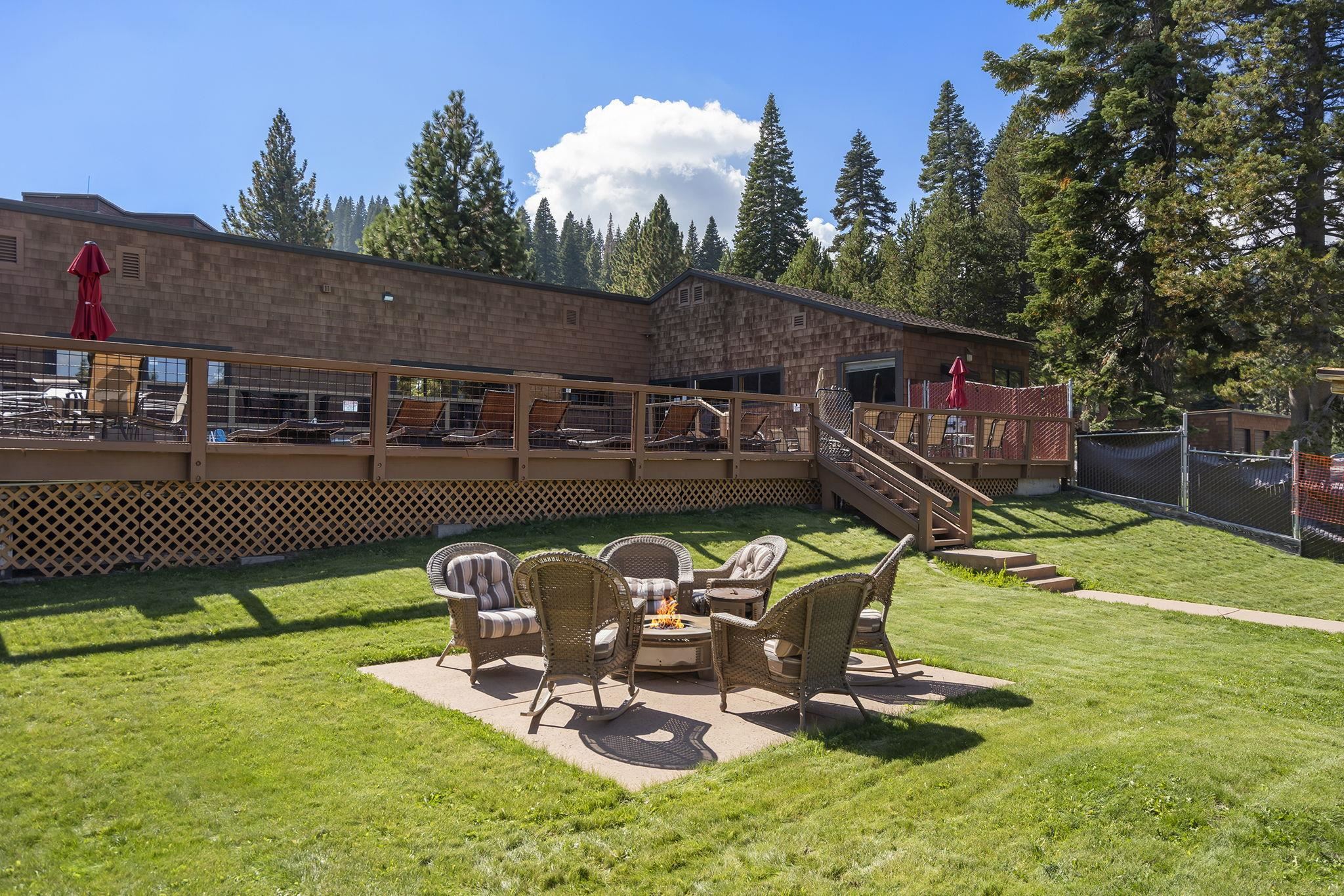 11591 Snowpeak Way, Unit 407 Truckee, CA 96161 - Photo 19 of 21 a view of a patio with a table chairs and a table