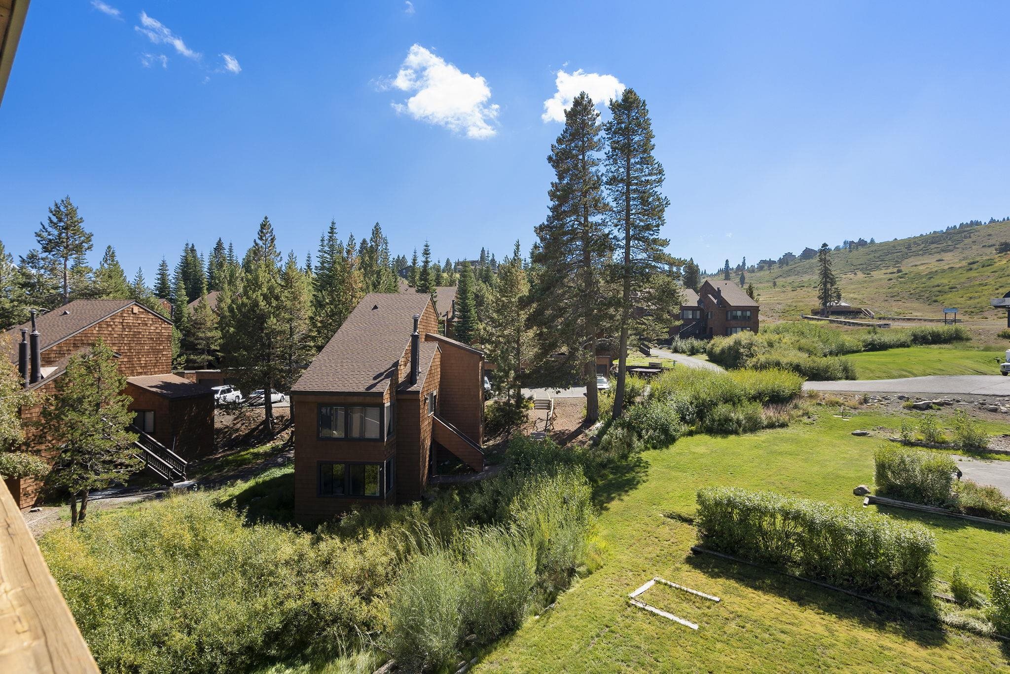11591 Snowpeak Way, Unit 407 Truckee, CA 96161 - Photo 2 of 21 a view of a garden with a house