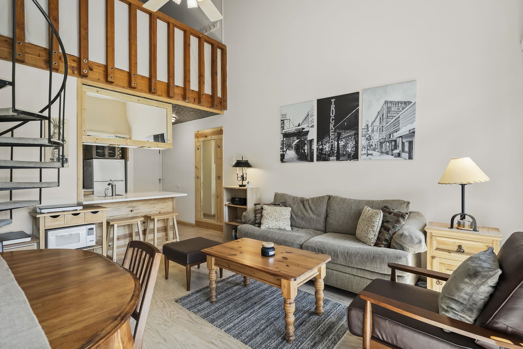 11591 Snowpeak Way, Unit 407 Truckee, CA 96161 - Photo 6 of 21 a living room with furniture and a table
