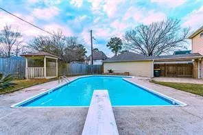 a view of swimming pool with a yard