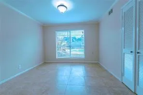 an empty room with a empty space and windows