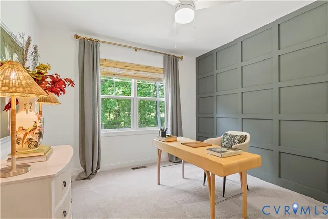 a living room with a table and a window