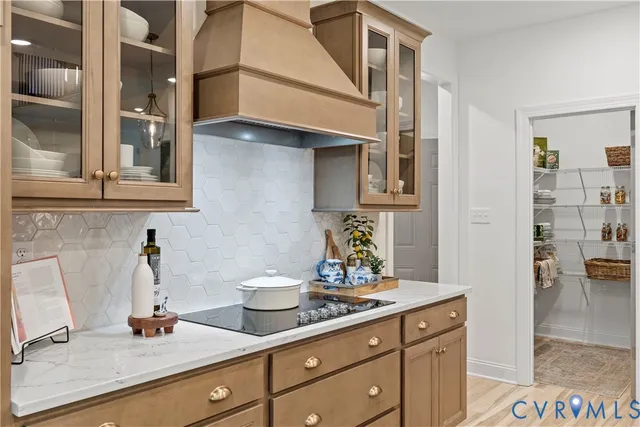 a kitchen with stainless steel appliances a sink and cabinets