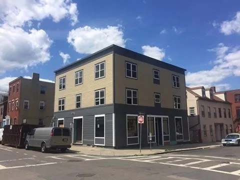 a front view of a building with a street