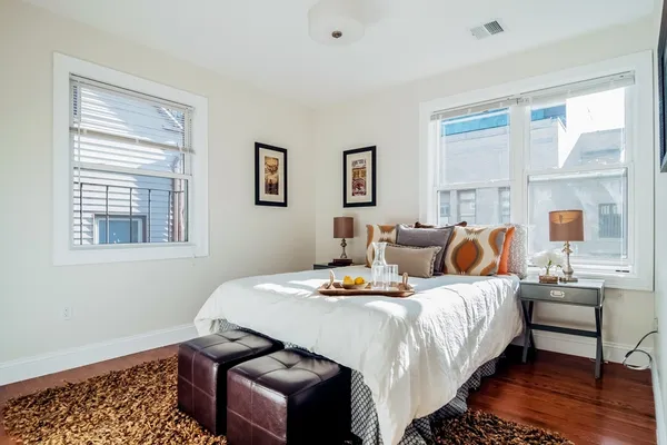 a bedroom with bed and window