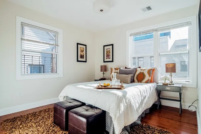 a bedroom with bed and window