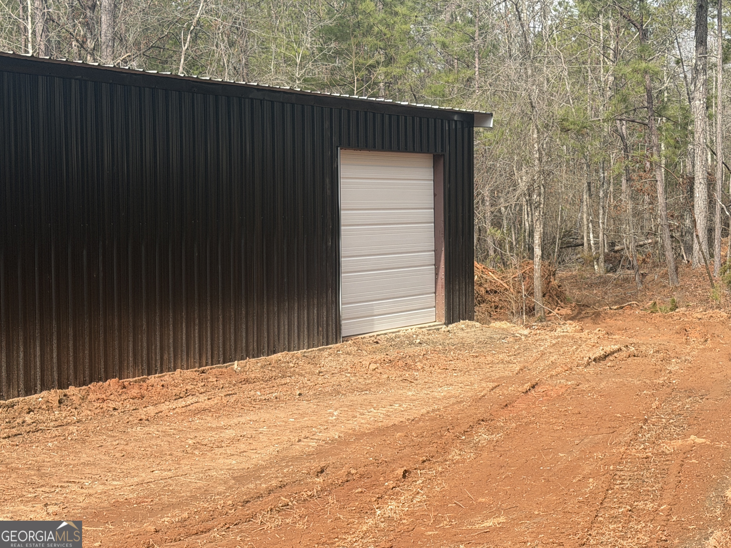 90 Rivers Road Williamson, GA 30292 - Photo 4 of 5 a house with trees in front of it