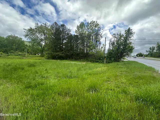 a view of outdoor space with deck and yard