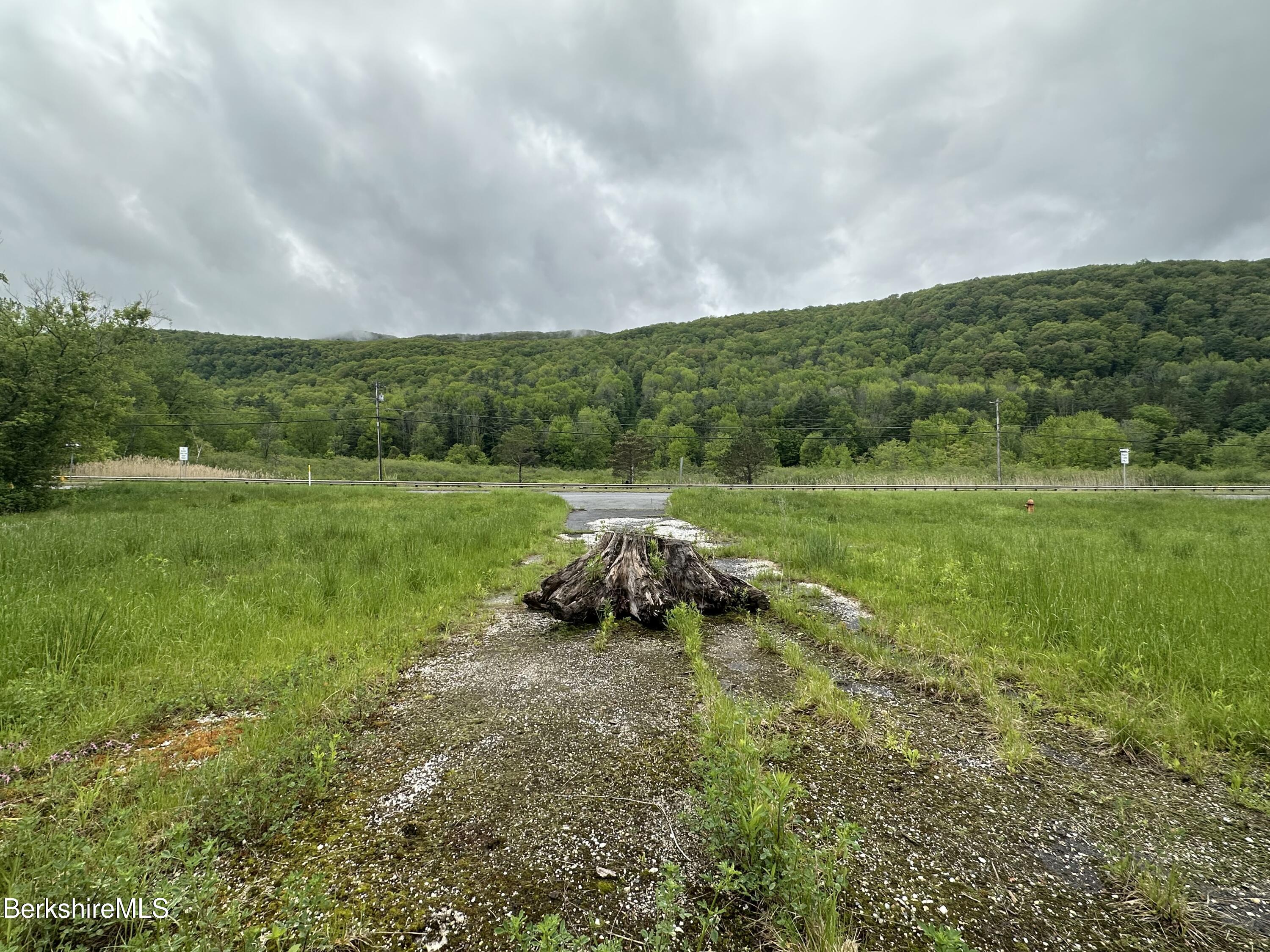 1268 Curran Highway North Adams, MA 01247 - Photo 17 of 19 a backyard of a house with a yard and outdoor seating