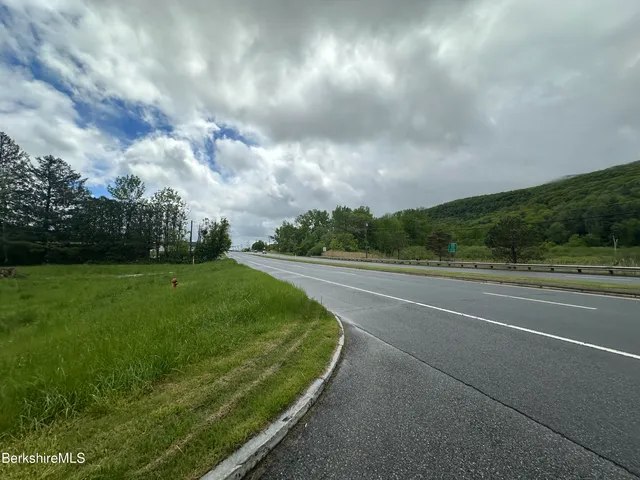 a view of grassy field with trees