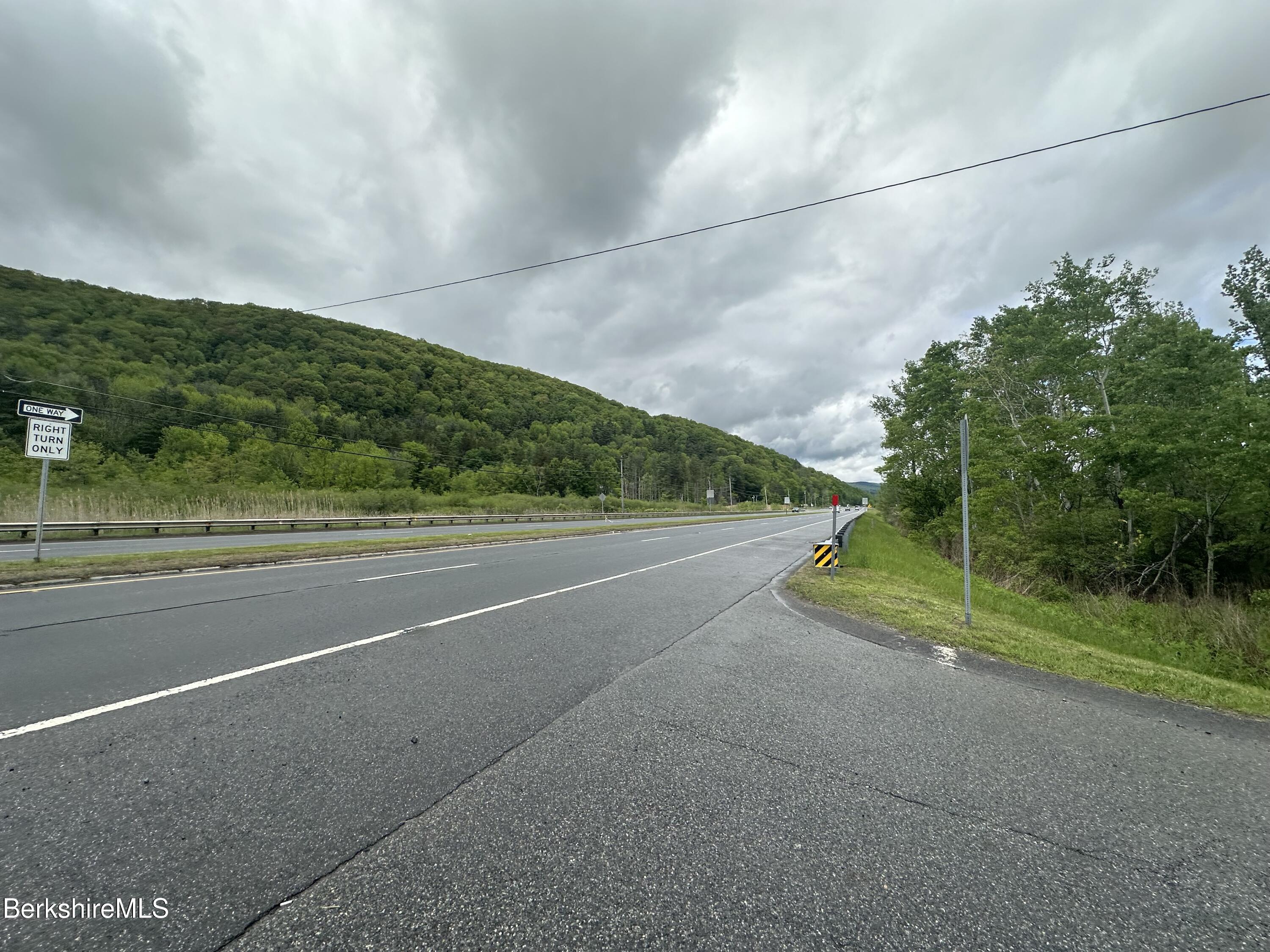 1268 Curran Highway North Adams, MA 01247 - Photo 6 of 19 a view of a road with a big yard
