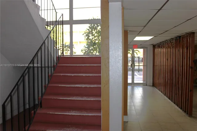 a view of entryway with stairs and wooden floor