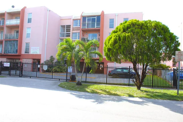 a view of a backyard with a garden and plants