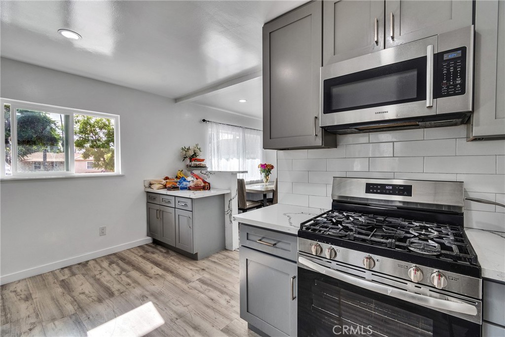 5121 Sierra Street Riverside, CA 92504 - Photo 18 of 34 a kitchen with a stove and a microwave