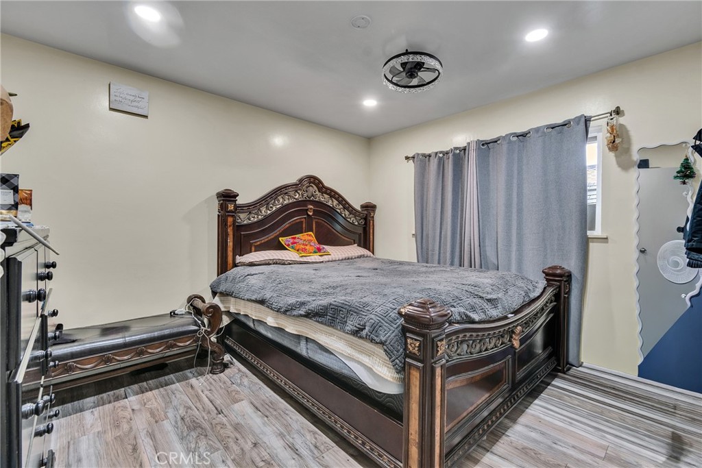 5121 Sierra Street Riverside, CA 92504 - Photo 23 of 34 a bed sitting in a bedroom next to a window