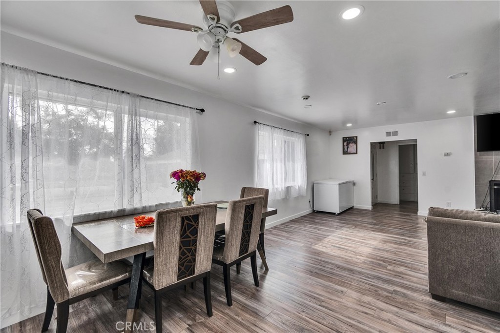 5121 Sierra Street Riverside, CA 92504 - Photo 29 of 34 a view of a dining room with furniture window and wooden floor