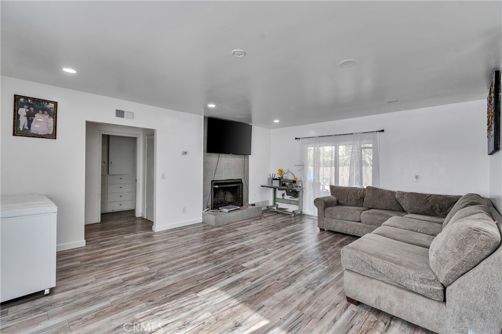 5121 Sierra Street Riverside, CA 92504 - Photo 30 of 34 a living room with furniture and a fireplace