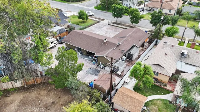 an aerial view of a house with outdoor space