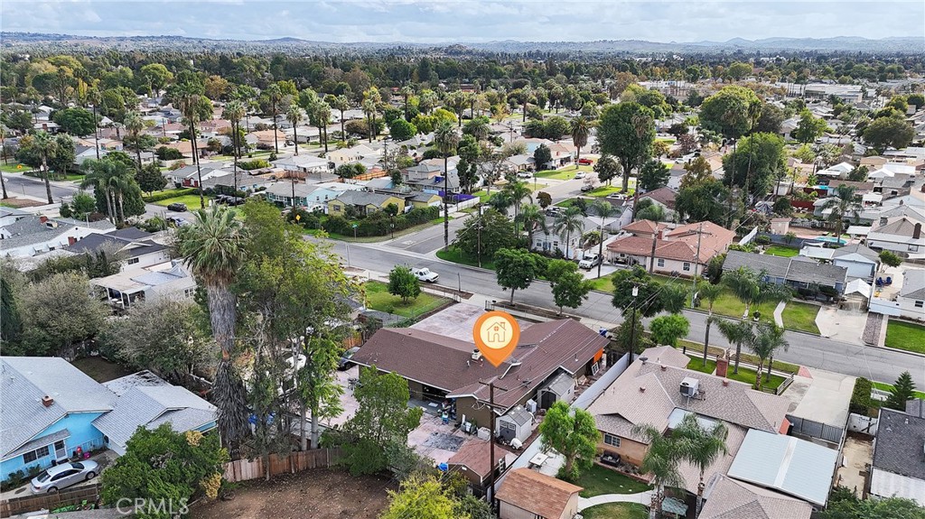 5121 Sierra Street Riverside, CA 92504 - Photo 6 of 34 an aerial view of a city with lots of residential buildings